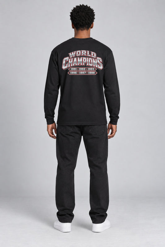 Chicago 6-Time City Champions black 220 GSM long-sleeve T-shirt on male model – full-body back view with small centered championship artwork | City 2 City Wear