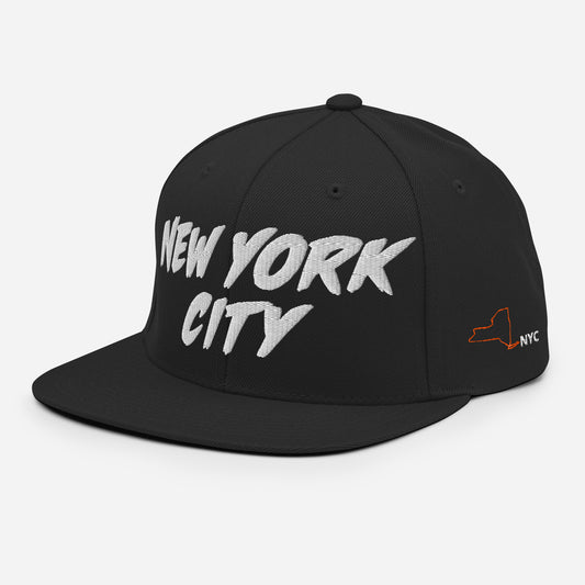Angled view of a black New York City snapback with white front embroidery and orange CONCRETE JUNGLE side lettering.