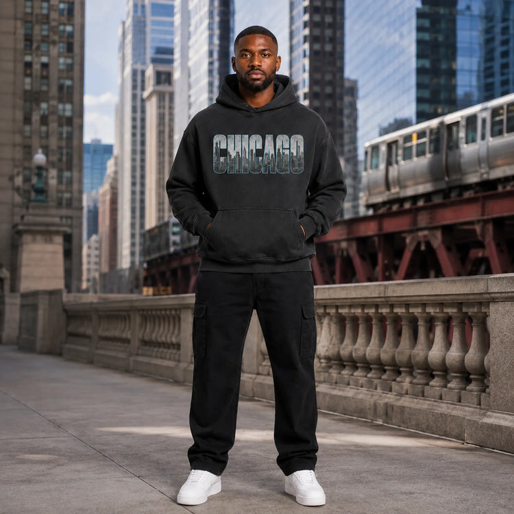 City 2 City Wear Chicago Collection featuring a model in the Windy City skyline 440 GSM oversized hoodie in downtown Chicago