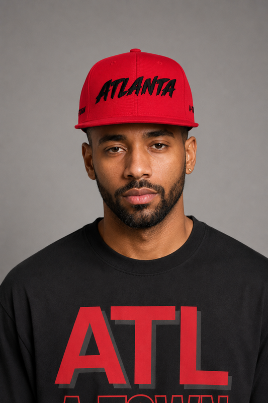 Atlanta A-Town Red Embroidered Snapback Hat — front close-up Atlanta model wearing red snapback with black ATLANTA embroidery and black Atlanta A-Town Skyline T-shirt | City 2 City Wear