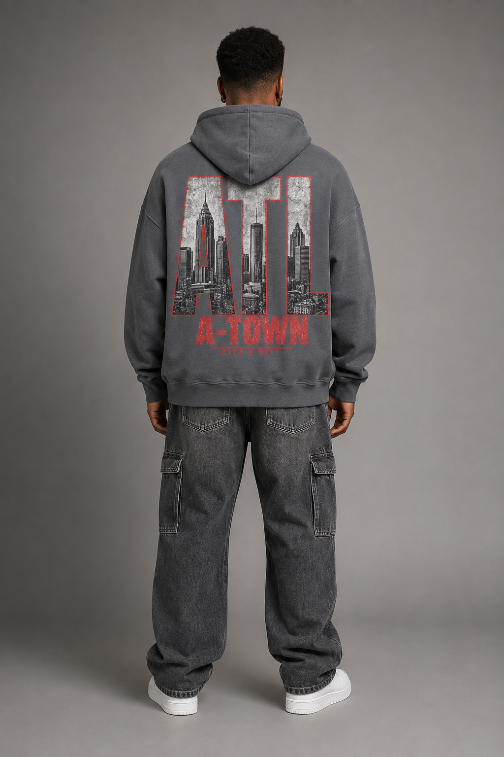 Atlanta A-Town Skyline 440 GSM Oversized Hoodie, Carbon Gray back-view full-body men’s studio model photo, Atlanta | City 2 City Wear