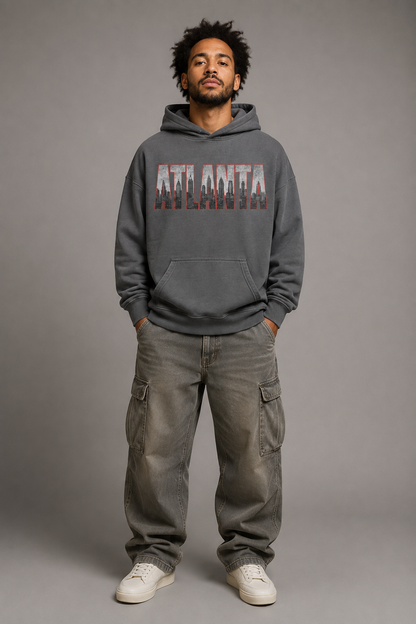 Atlanta A-Town Skyline 440 GSM Oversized Hoodie, Carbon Gray front-view full-body men’s studio model photo, Atlanta | City 2 City Wear
