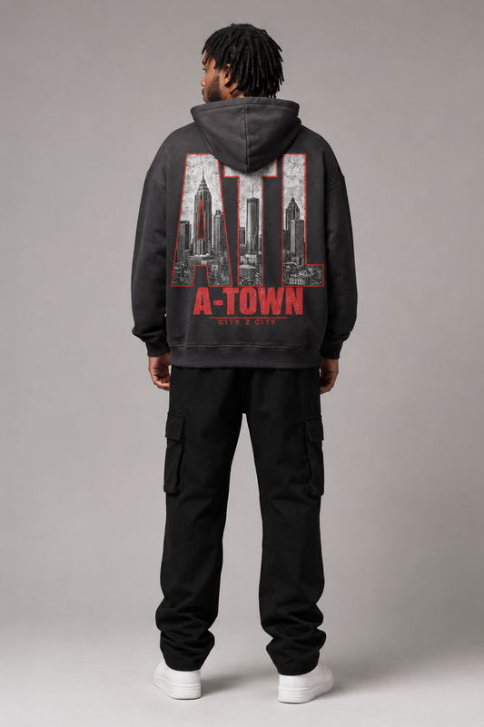 Atlanta A-Town Skyline 440 GSM Oversized Hoodie, Faded Black back-view full-body men’s studio model photo, Atlanta | City 2 City Wear