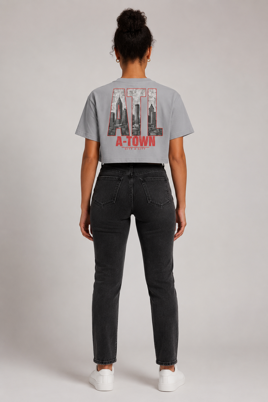 Atlanta A-Town Skyline Women’s Crop T-Shirt, Light Gray back-view full-body women’s studio model photo featuring ATL skyline artwork | City 2 City Wear