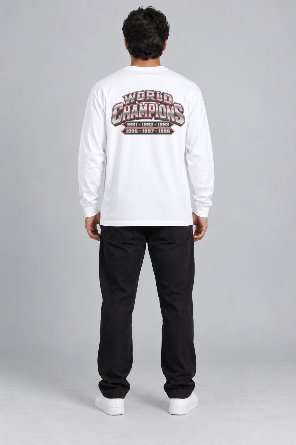 Chicago 6-Time City Champions white 220 GSM long-sleeve T-shirt on male model – full-body back view with small centered championship artwork | City 2 City Wear