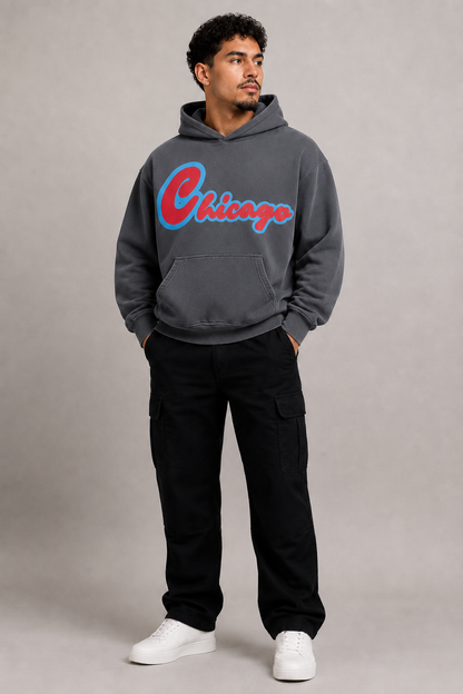 Chicago Script 440 GSM Heavyweight Washed Oversized Hoodie, Carbon Gray three-quarter front full-body men’s studio model photo, Chicago | City 2 City Wear