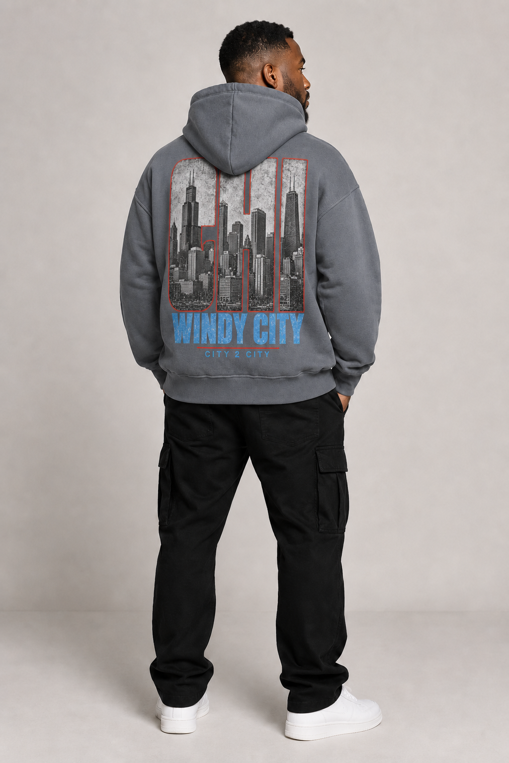 Chicago Windy City Skyline 440 GSM Oversized Hoodie, Carbon Gray back-view full-body men’s studio model photo, Chicago | City 2 City Wear