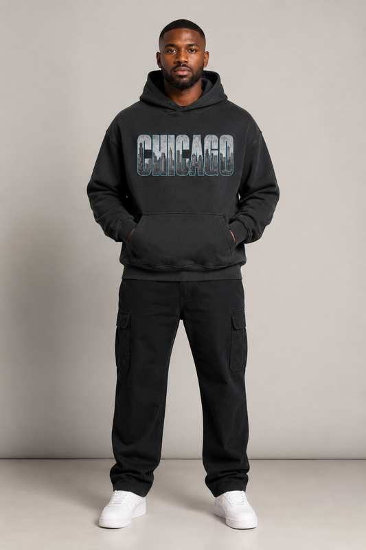 Chicago Windy City Skyline 440 GSM Oversized Hoodie, Faded Black front-view full-body men’s studio model photo, Chicago | City 2 City Wear
