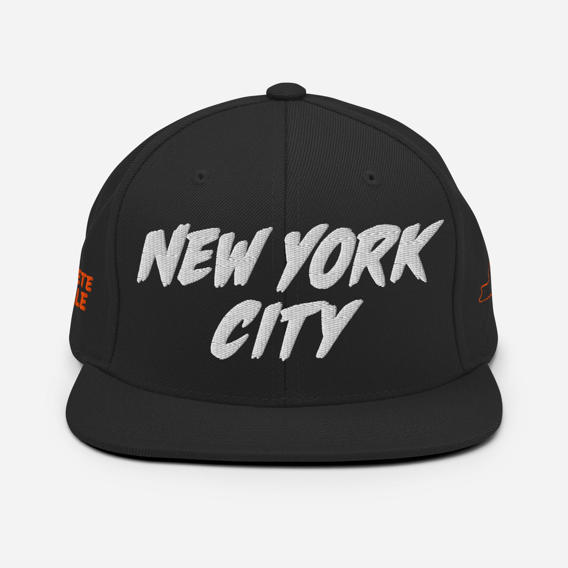 Front view of a black snapback hat featuring large white embroidered NEW YORK CITY lettering.