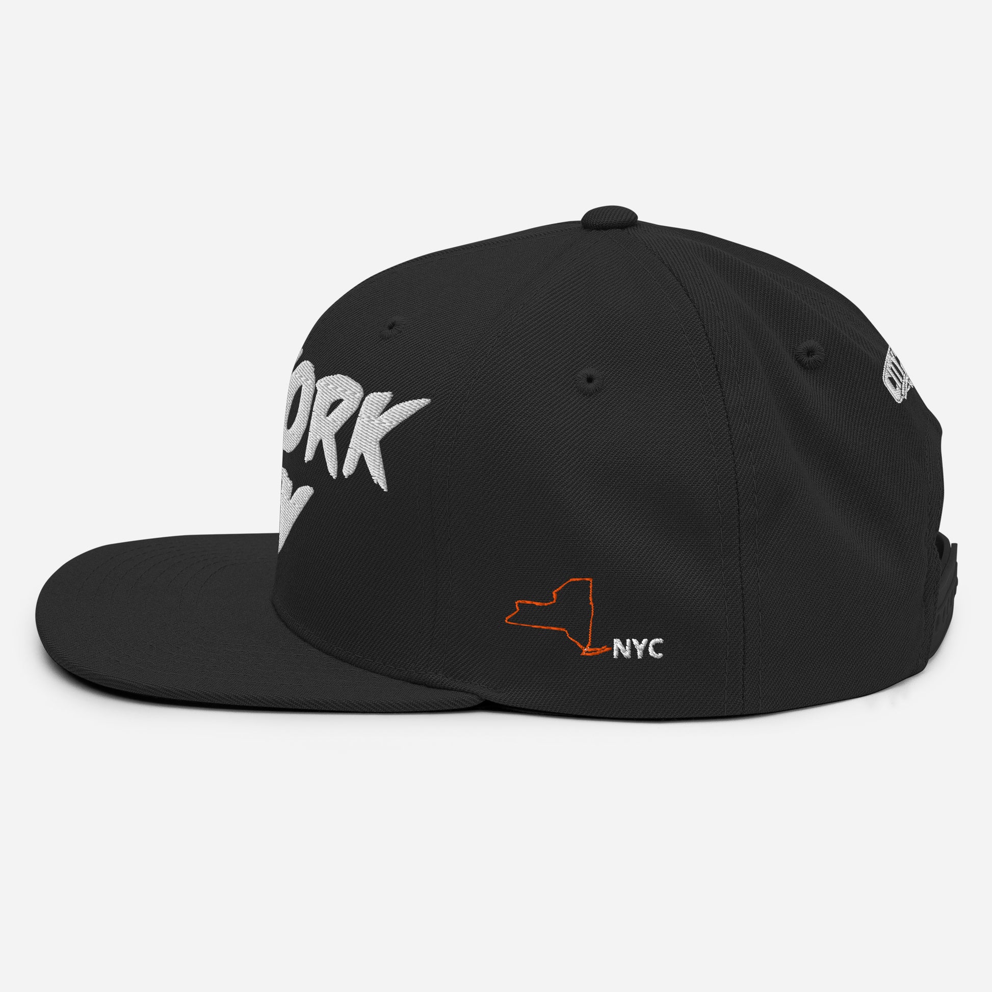 Side view of a black NYC snapback featuring an orange New York State outline with white NYC lettering.