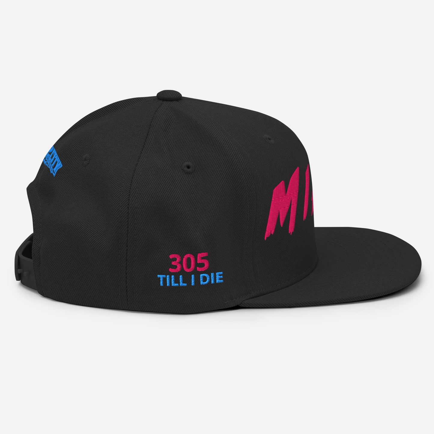 Angled view of a black Miami snapback with pink front embroidery and pink-and-blue 305 TILL I DIE side details.