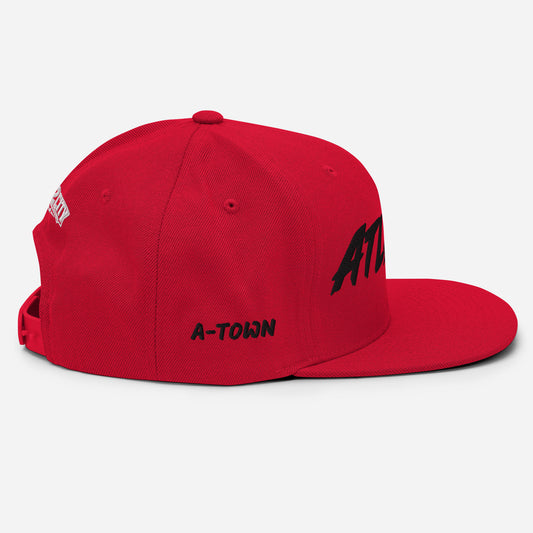 Side view of a red Atlanta snapback featuring embroidered A-TOWN lettering in black.