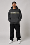 Los Angeles City of Angels Skyline 440 GSM Oversized Hoodie, Faded Black front-view full-body men’s studio model photo, Los Angeles | City 2 City Wear