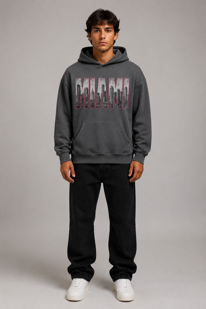 Miami 305 Till I Die Skyline 440 GSM Oversized Hoodie, Carbon Gray front-view full-body men’s studio model photo, Miami | City 2 City Wear