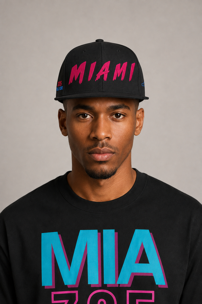 Miami 305 Till I Die Black Embroidered Snapback Hat — front close-up Miami model wearing black snapback with hot-pink MIAMI embroidery and Miami 305 Skyline T-shirt | City 2 City Wear