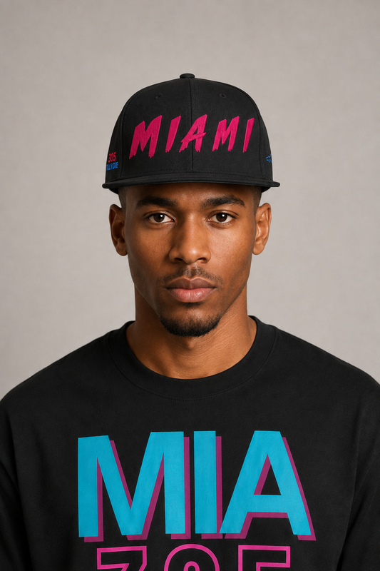 Miami 305 Till I Die Black Embroidered Snapback Hat — front close-up Miami model wearing black snapback with hot-pink MIAMI embroidery and Miami 305 Skyline T-shirt | City 2 City Wear