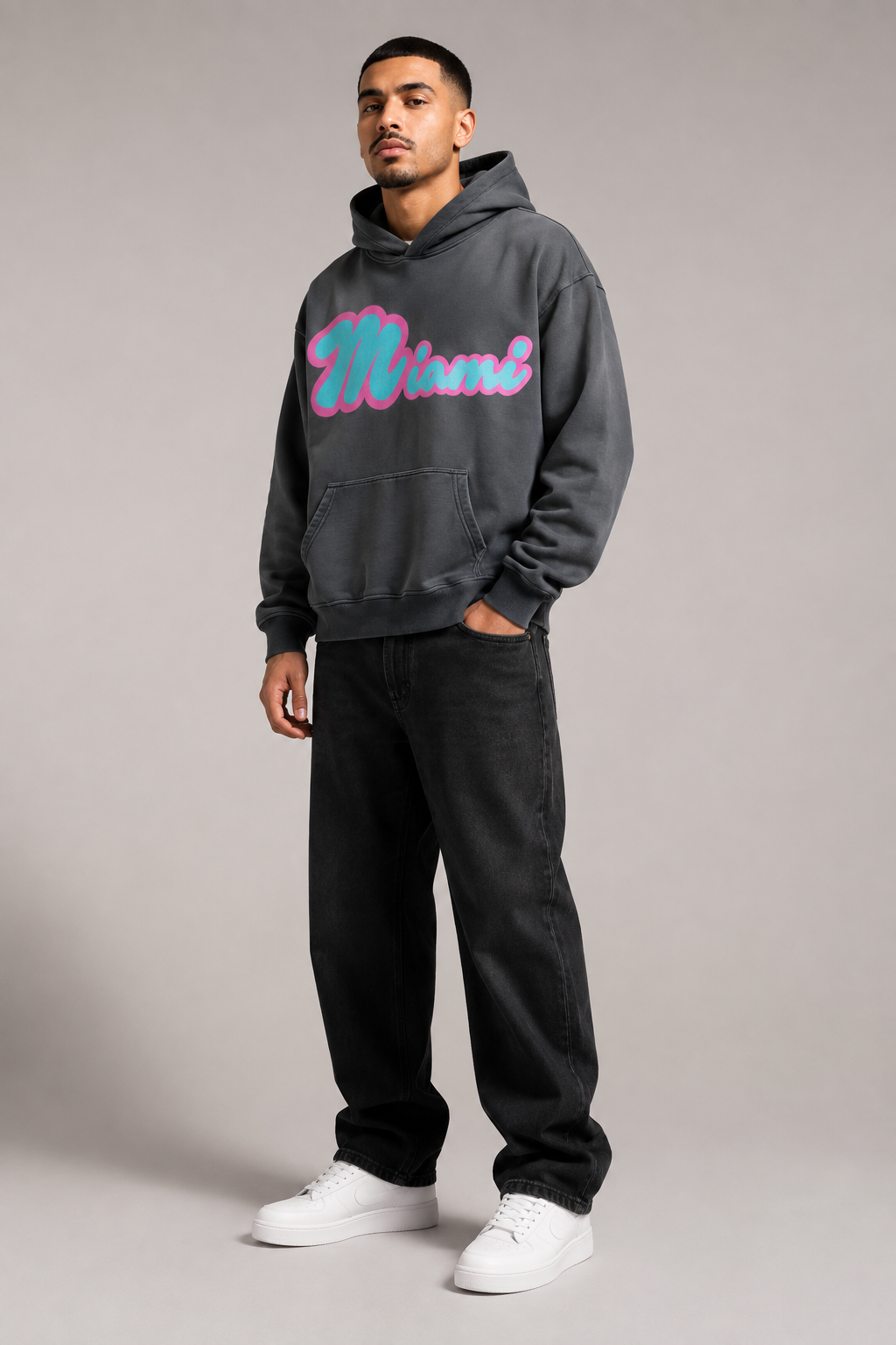 Miami Script Teal & Pink 440 GSM Heavyweight Washed Oversized Hoodie, Carbon Gray three-quarter front full-body men’s studio model photo, Miami | City 2 City Wear