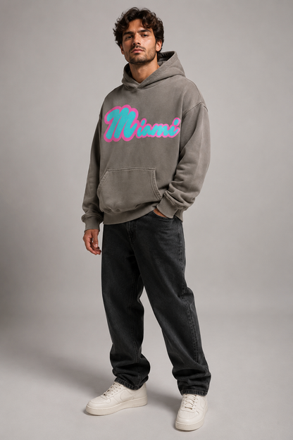 Miami Script Teal & Pink 440 GSM Heavyweight Washed Oversized Hoodie, Friar Gray three-quarter front full-body men’s studio model photo, Miami | City 2 City Wear