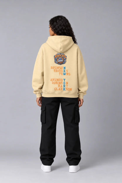 New York City Champions 2026 desert sand 440 GSM oversized hoodie on female model – full-body back view | City 2 City Wear