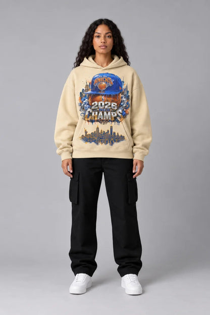 New York City Champions 2026 desert sand 440 GSM oversized hoodie on female model – full-body front view | City 2 City Wear