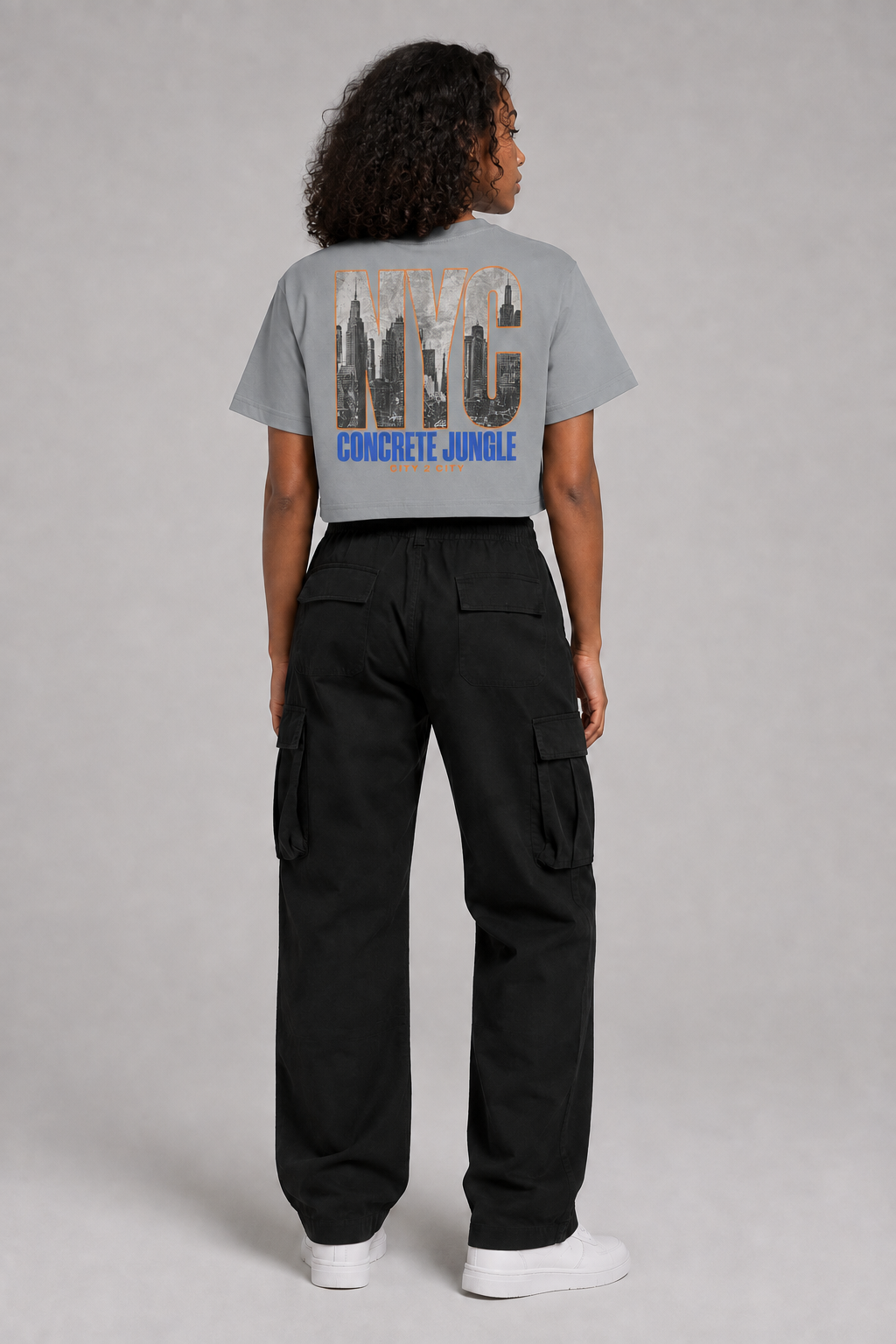 New York City Skyline Women’s Crop T-Shirt in Light Gray, full-body back-view women's studio model photo | City 2 City Wear