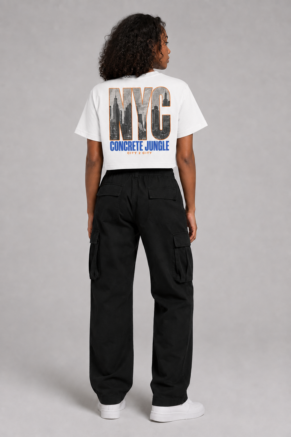 New York City Skyline Women’s Crop T-Shirt in White, full-body back-view women's studio model photo | City 2 City Wear