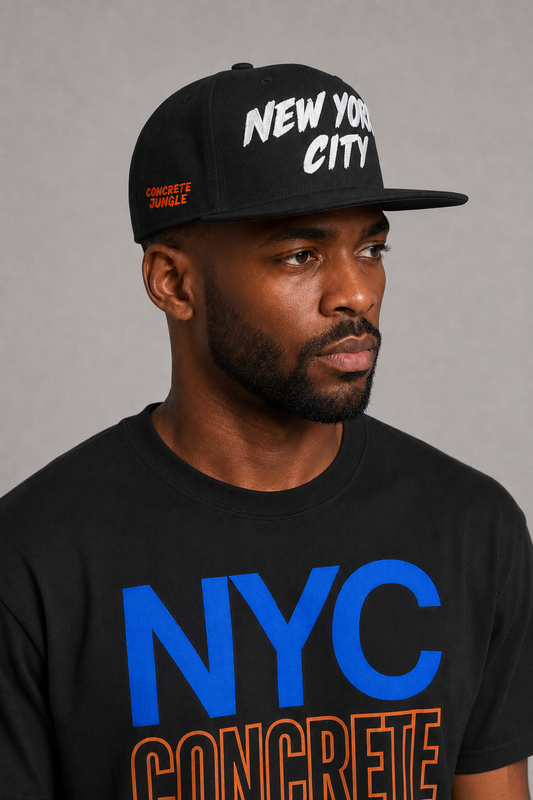 New York City Concrete Jungle Black Embroidered Snapback Hat — close-up model profile showing orange CONCRETE JUNGLE side embroidery | City 2 City Wear