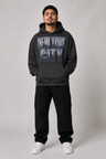 New York City Concrete Jungle Skyline 440 GSM Oversized Hoodie, Faded Black front-view full-body men's studio model photo | City 2 City Wear