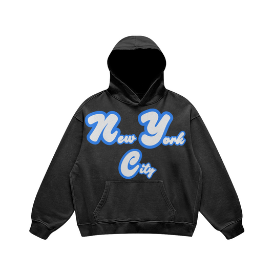 Front view of a washed-black oversized hoodie featuring white New York City script outlined in royal blue.