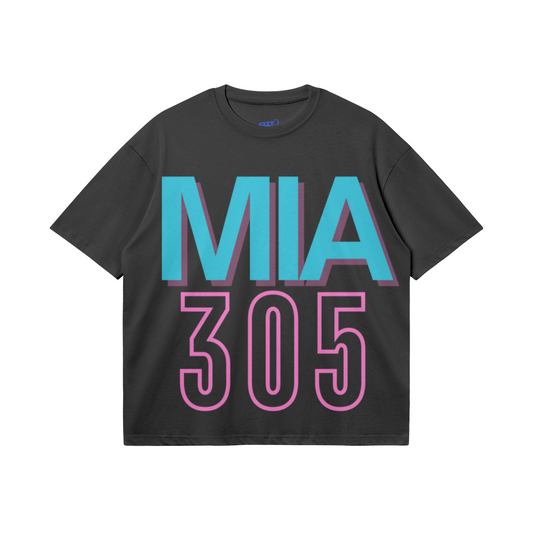 Black heavyweight boxy T-shirt featuring oversized teal MIA lettering with a pink shadow and a large hot-pink outlined 305 design.