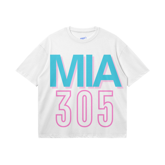 White heavyweight boxy T-shirt featuring oversized teal MIA lettering with a pink shadow and a large hot-pink outlined 305 design.